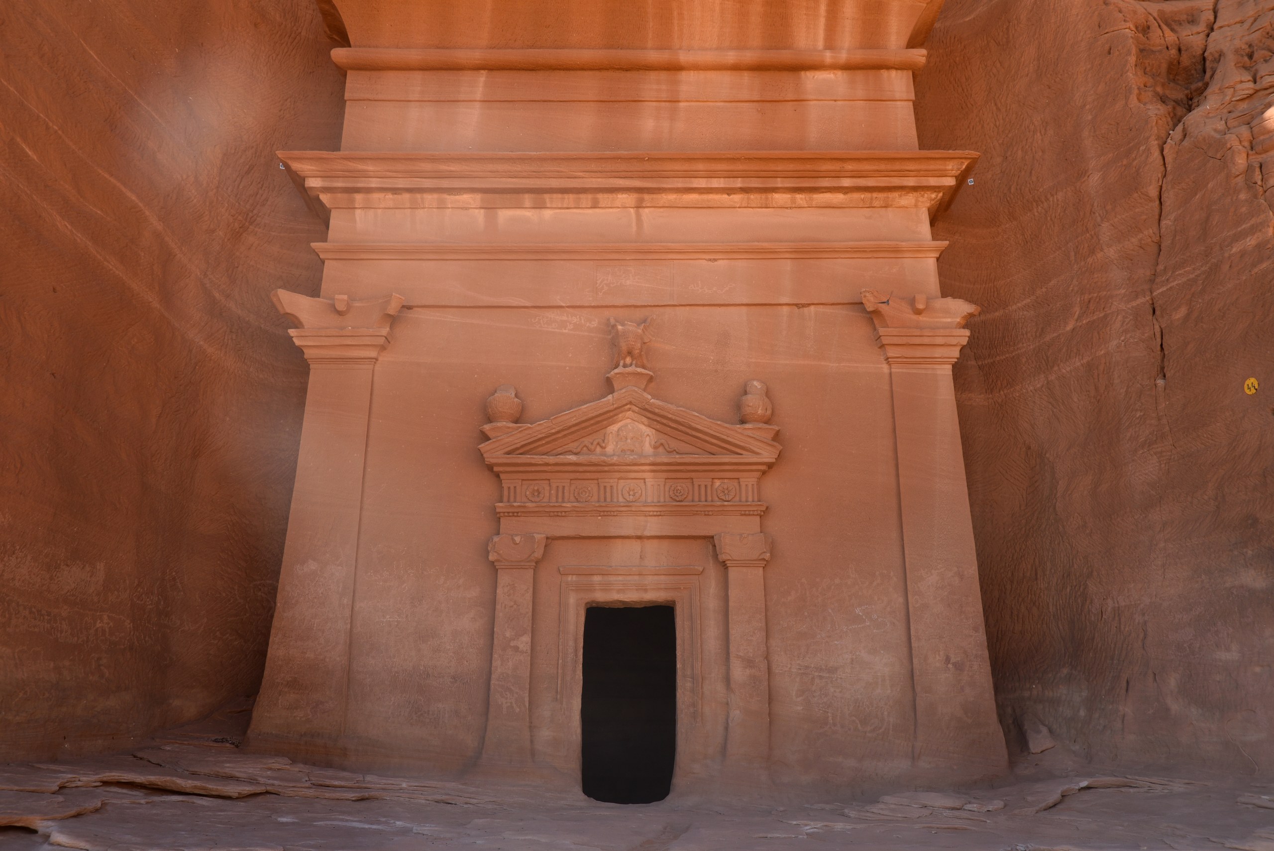 Nabataean tomb facade cut into a sandstone cliff at Hegra